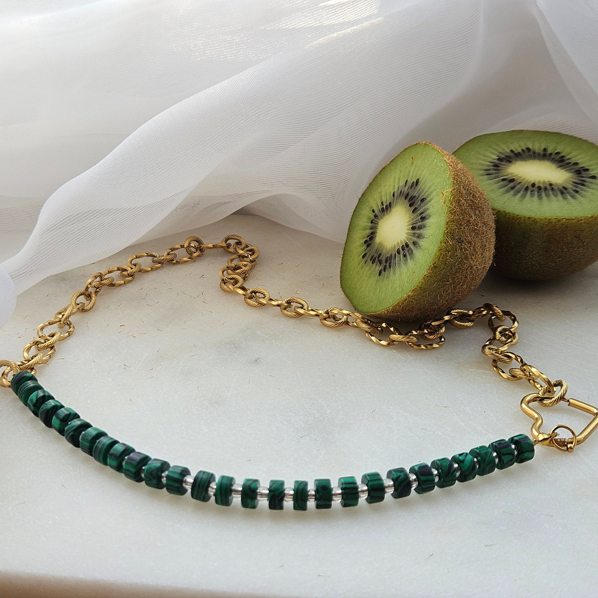 Green malachite bead necklace combined with a chunky silver stainless steel chain and a heart-shaped clasp.