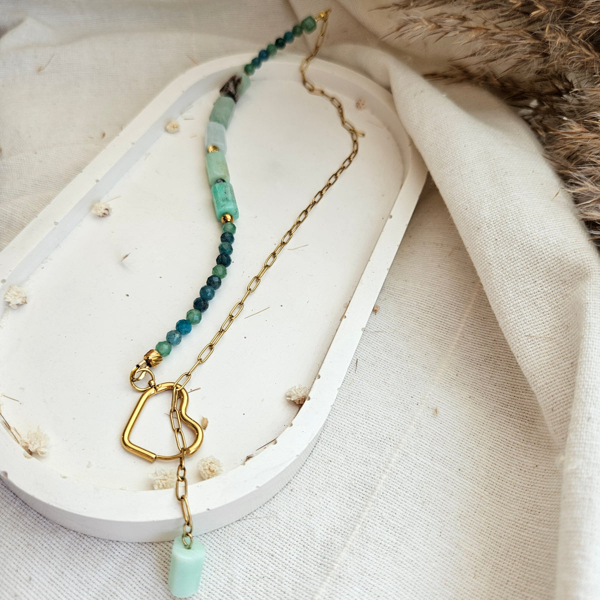 Green gemstone necklace featuring green aventurine, Australian chrysoprase , faceted apatite beads and a heart-shaped stainless steel clasp.